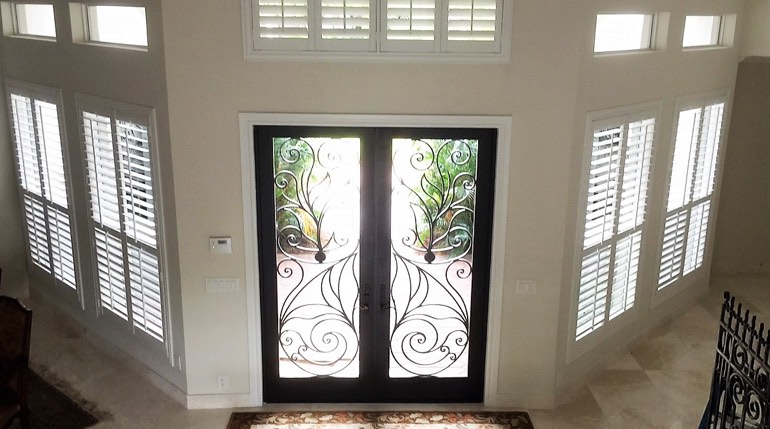Kingsport foyer with glass doors and indoor shutters